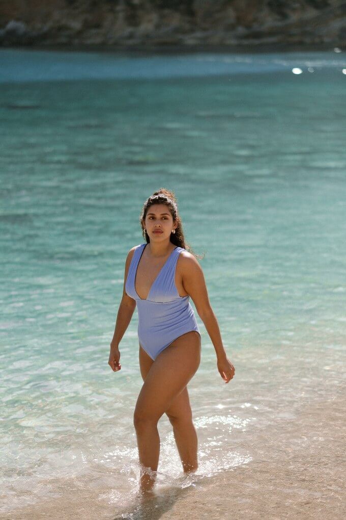 Model wearing a swimsuit by the sea