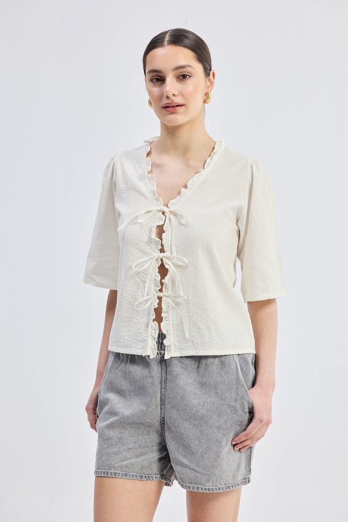Relaxed Fit Top With Ruffles and Front-Ties in Cream from Reistor