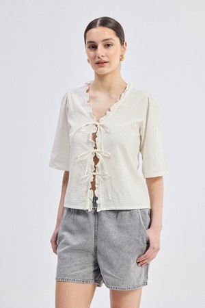 Relaxed Fit Top With Ruffles and Front-Ties in Cream from Reistor