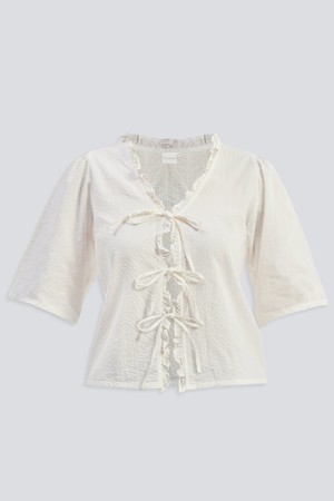 Relaxed Fit Top With Ruffles and Front-Ties in Cream from Reistor