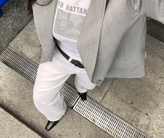 Consumer buried underneath a pile of clothes they didn't need
